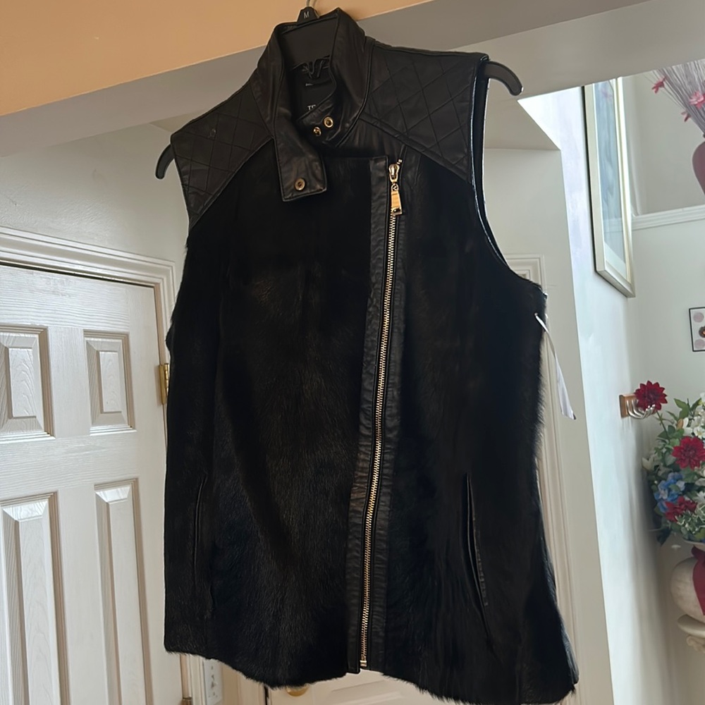 Real Goat fur, purchased from sak 5th , in bag very beautiful..